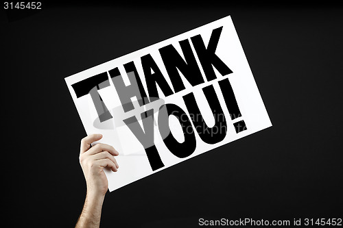 Image of Man holding poster with thank you