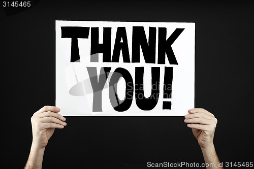 Image of Man holding poster with thank you