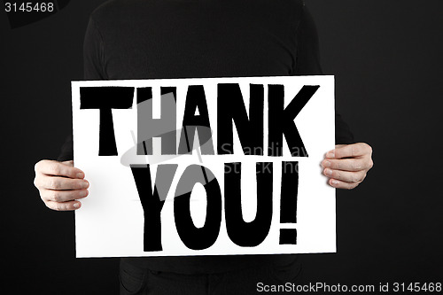 Image of Man holding poster with thank you