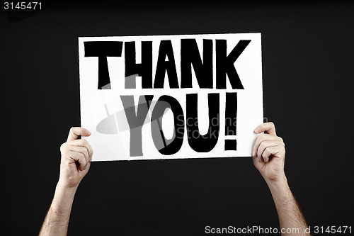 Image of Man holding poster with thank you