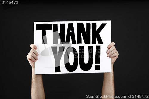 Image of Man holding poster with thank you