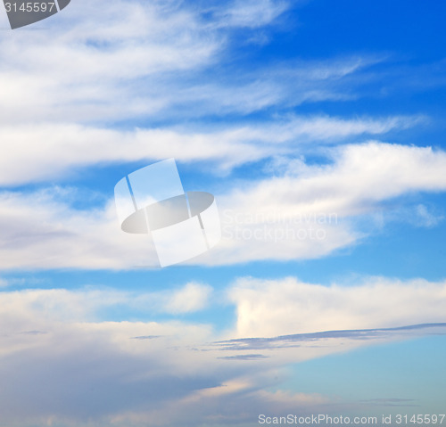 Image of the sunrise in  colored sky white soft clouds and abstract backg