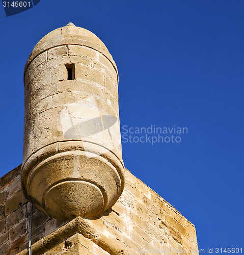 Image of  brick in old construction  africa morocco and   the tower near 