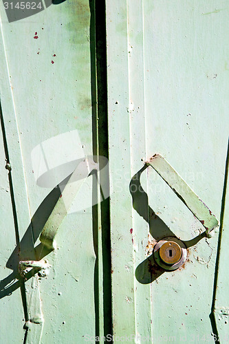 Image of metal rusty  brown    morocco in africa the green  safe padlock 