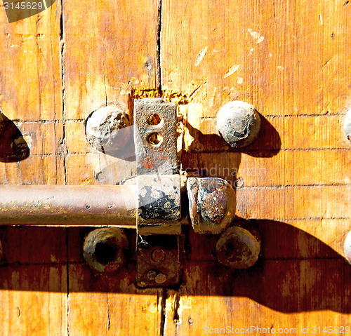 Image of rusty  brown    morocco in africa the old wood  facade home and 