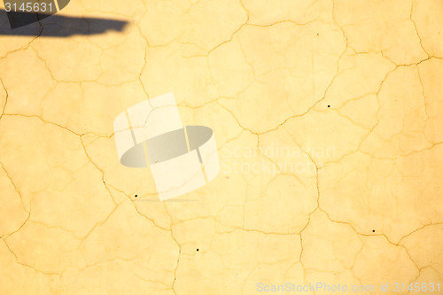 Image of pink in texture wall and  yellow shadow