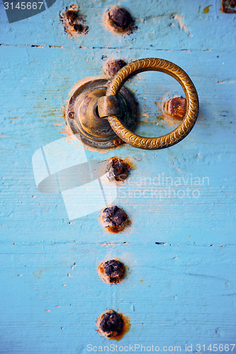 Image of rusty metal nail dirty stripped paint 
