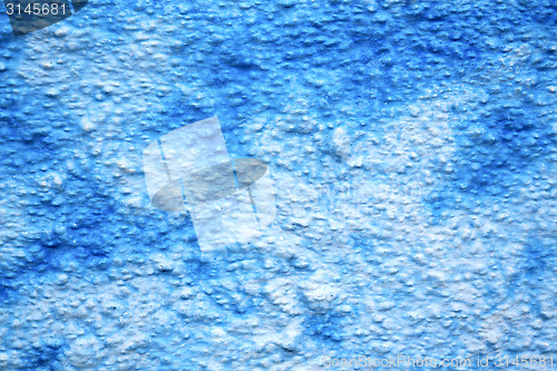 Image of blue  in texture wall and   