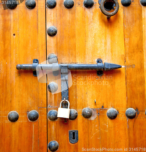 Image of rusty  brown    morocco in africa the old wood  facade home and 