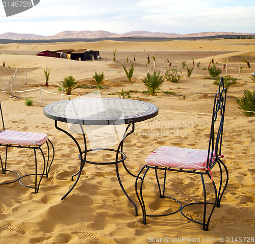 Image of table and seat in desert  sahara morocco    africa yellow sand