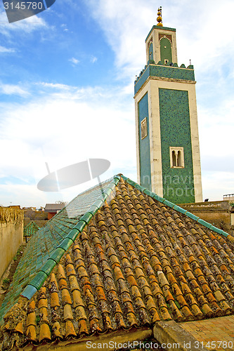 Image of  muslim   in   mosque  the history     africa  minaret    sky