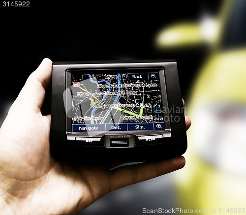 Image of Gps in a man hand.