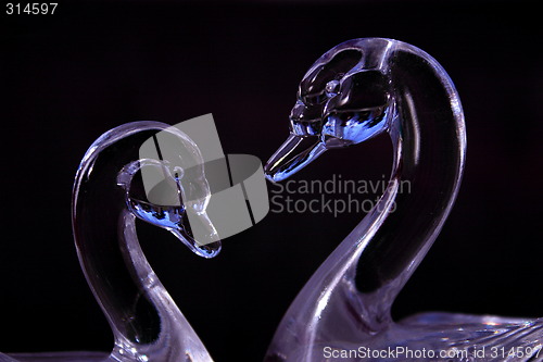 Image of purple glass swans