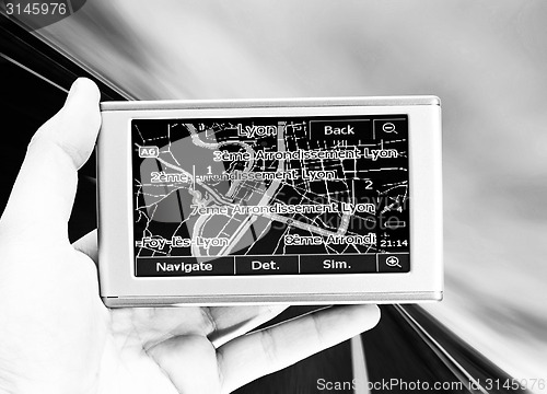 Image of GPS Vehicle navigation system in a man hand.