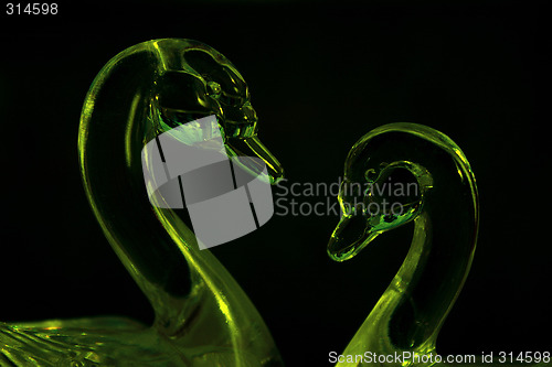 Image of green glass swans