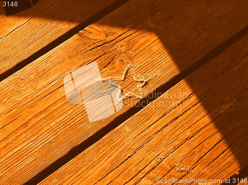 Image of sand star on boards