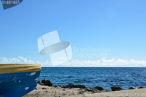 Image of Coastal view with a colorful boat