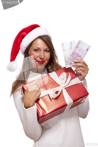 Image of Young woman with an Xmas gift and money