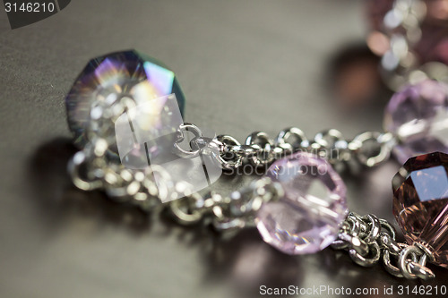 Image of Attractive shiny purple beads on jewellery