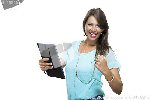 Image of Pretty Woman Browsing at her Tablet Computer