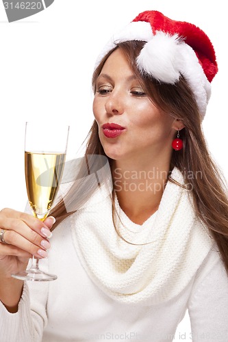 Image of Playful woman celebrating Xmas blowing a kiss