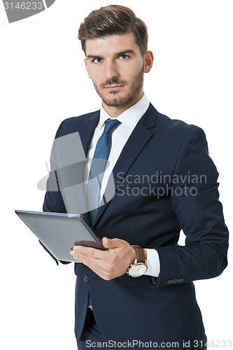 Image of Businessman using a tablet computer