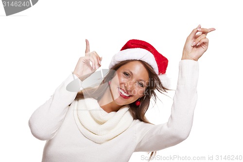 Image of Young woman in a Santa hat holding out her hands