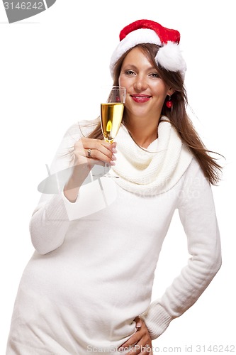 Image of Playful woman celebrating Xmas blowing a kiss