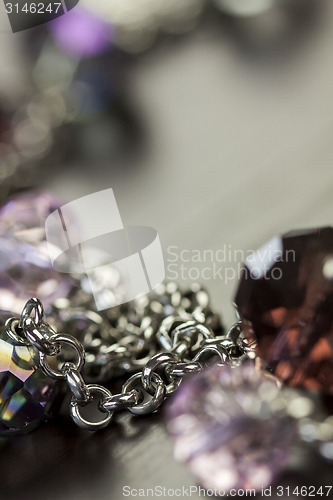 Image of Attractive shiny purple beads on jewellery