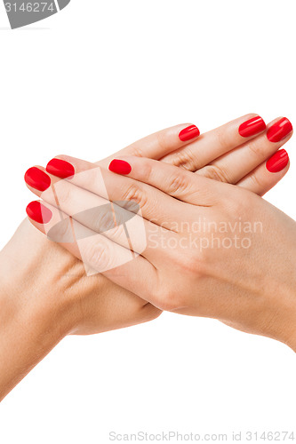 Image of Woman with beautiful manicured red fingernails