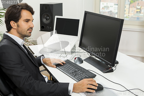 Image of Stylish businessman chatting on the phone