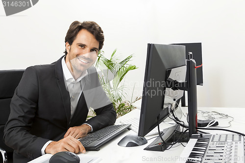 Image of Stylish businessman chatting on the phone