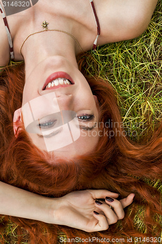 Image of Happy Woman Lying on Grassy Ground