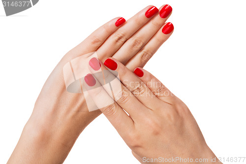 Image of Woman with beautiful manicured red fingernails