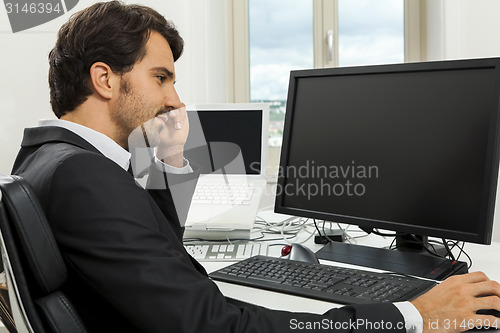 Image of Stylish businessman chatting on the phone