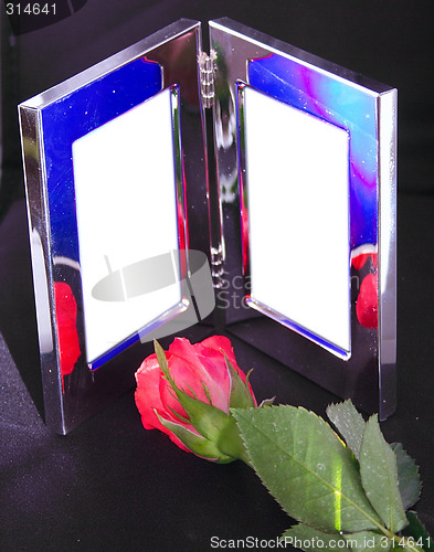 Image of silver frame and red rose