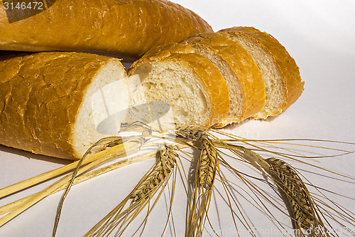 Image of Loaf of white bread and wheat 