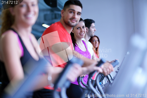 Image of Group of people running on treadmills