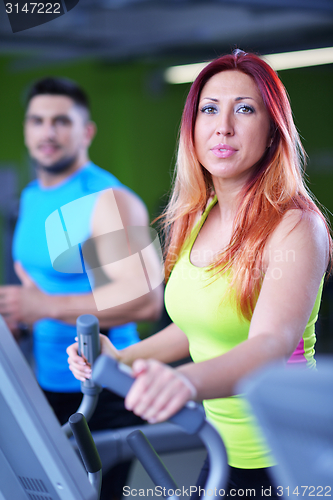 Image of Group of people running on treadmills