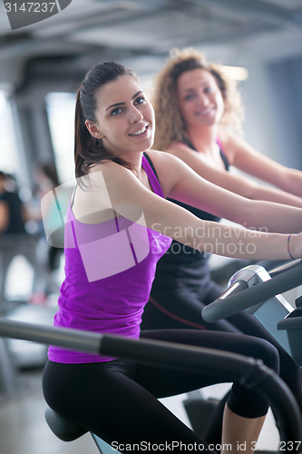 Image of Group of people running on treadmills