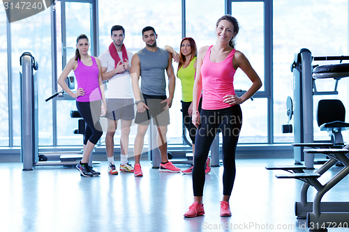 Image of Group of people exercising at the gym