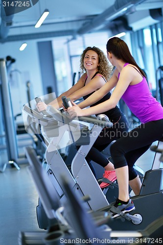 Image of Group of people running on treadmills