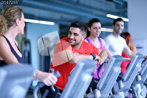 Image of Group of people running on treadmills