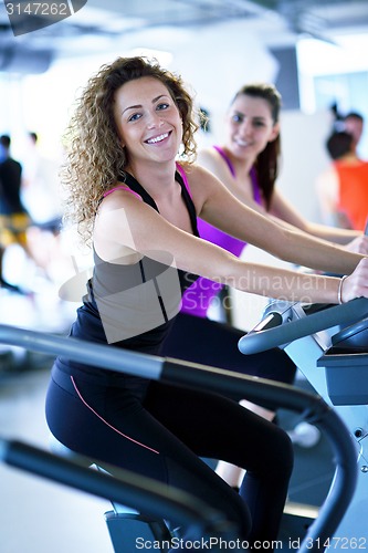 Image of Group of people running on treadmills