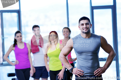 Image of Group of people exercising at the gym