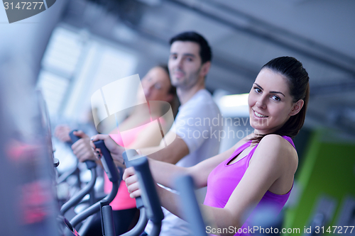Image of Group of people running on treadmills