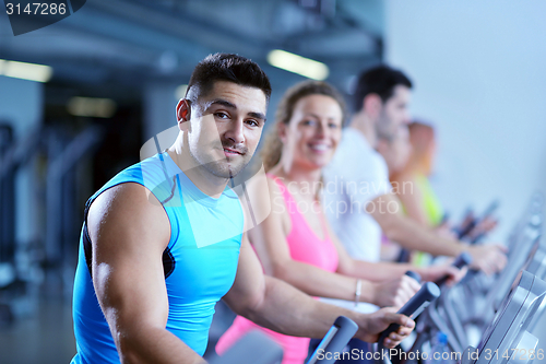 Image of Group of people running on treadmills