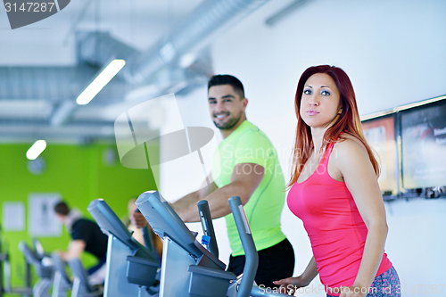 Image of Group of people running on treadmills