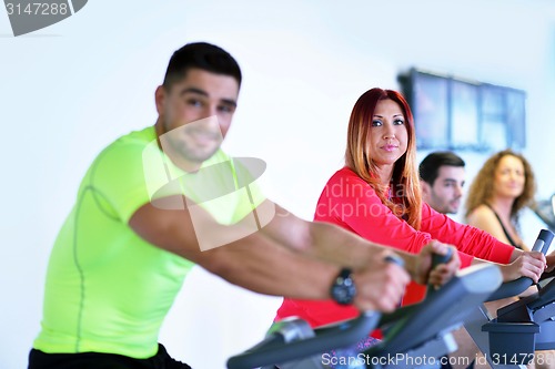 Image of Group of people running on treadmills