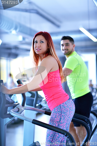 Image of Group of people running on treadmills